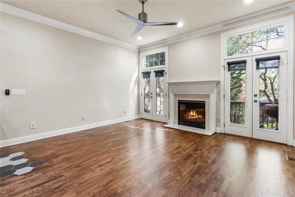 2663 Rivers Edge Drive Northeast Brookhaven, GA 30324 - Photo 14 of 37 a view of an empty room with wooden floor fireplace and a window
