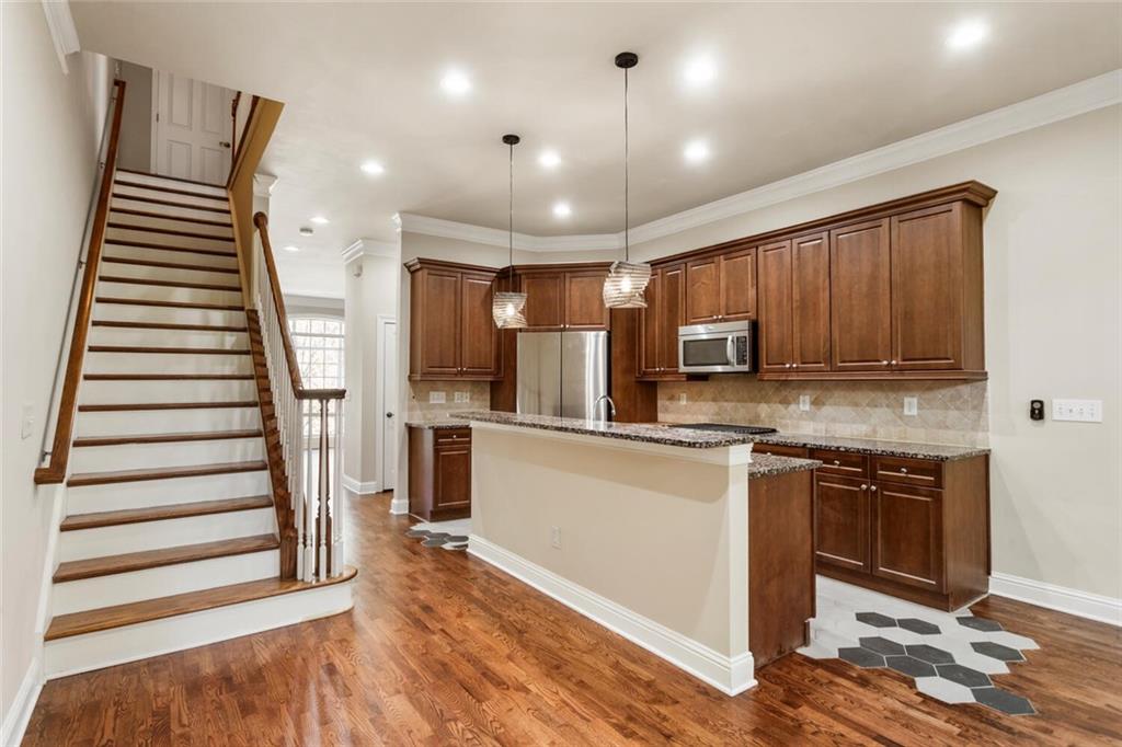 2663 Rivers Edge Drive Northeast Brookhaven, GA 30324 - Photo 19 of 37 a kitchen with stainless steel appliances granite countertop a refrigerator and a stove top oven