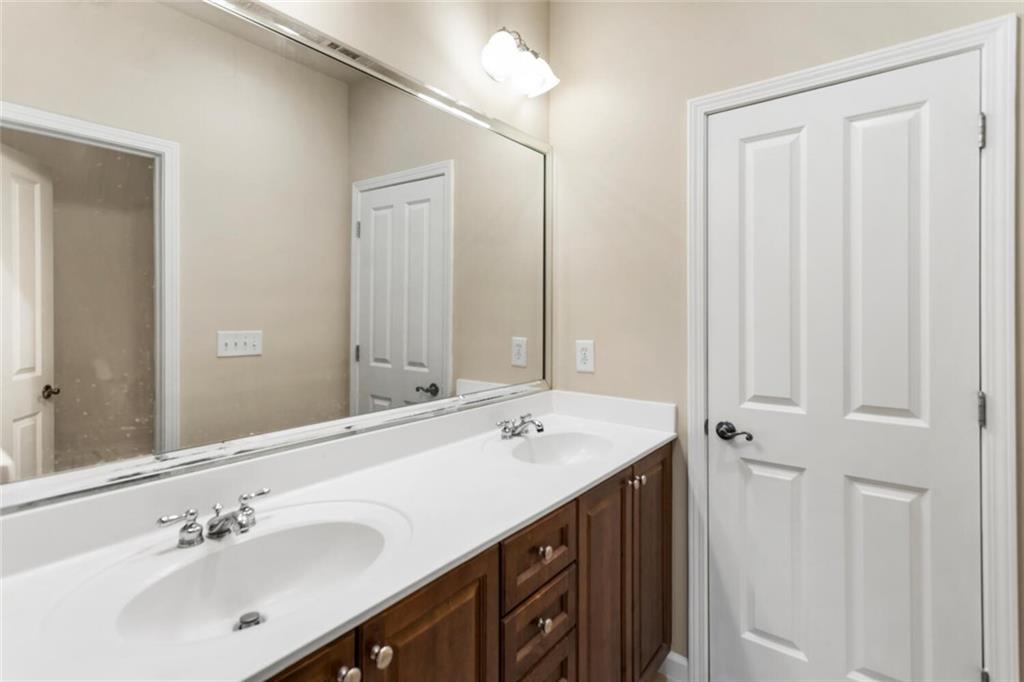 2663 Rivers Edge Drive Northeast Brookhaven, GA 30324 - Photo 25 of 37 a bathroom with a sink and a mirror