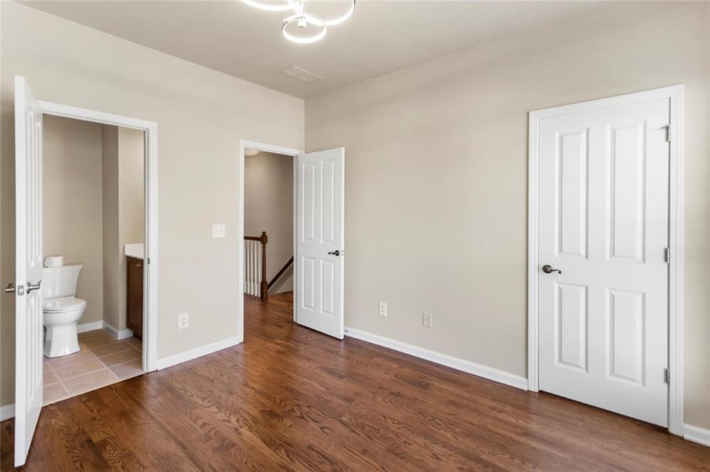 2663 Rivers Edge Drive Northeast Brookhaven, GA 30324 - Photo 26 of 37 a very nice looking room with wooden floor and a bathroom