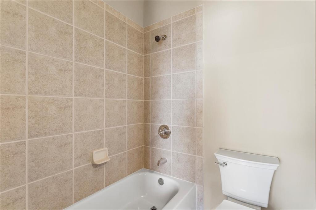 2663 Rivers Edge Drive Northeast Brookhaven, GA 30324 - Photo 28 of 37 a bathroom with a bathtub and a shower