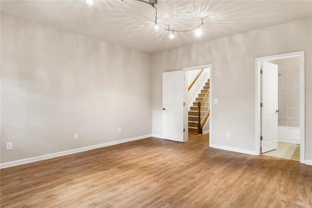 2663 Rivers Edge Drive Northeast Brookhaven, GA 30324 - Photo 31 of 37 wooden floor in an empty room