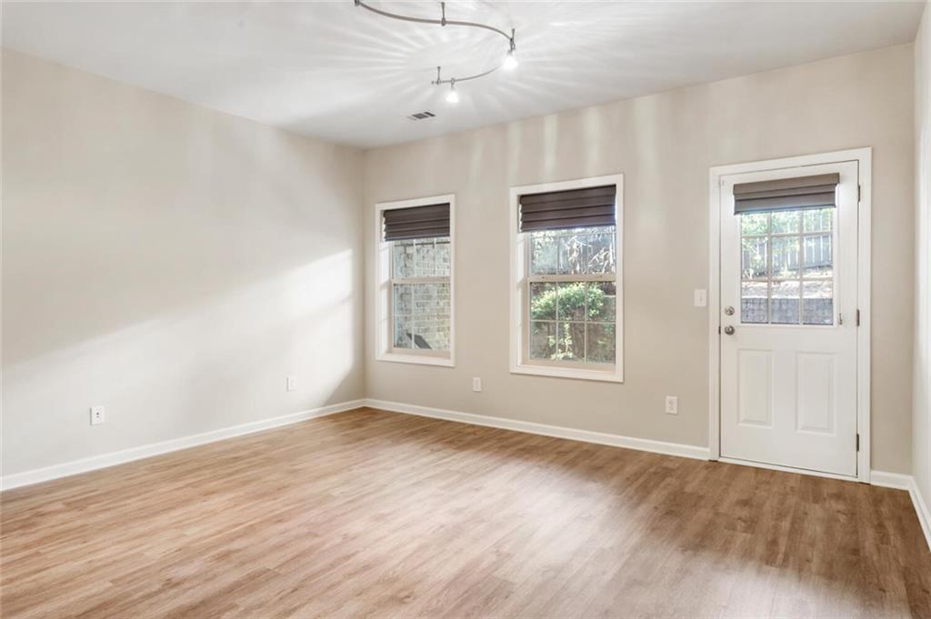 2663 Rivers Edge Drive Northeast Brookhaven, GA 30324 - Photo 32 of 37 a view of an empty room with wooden floor and a window