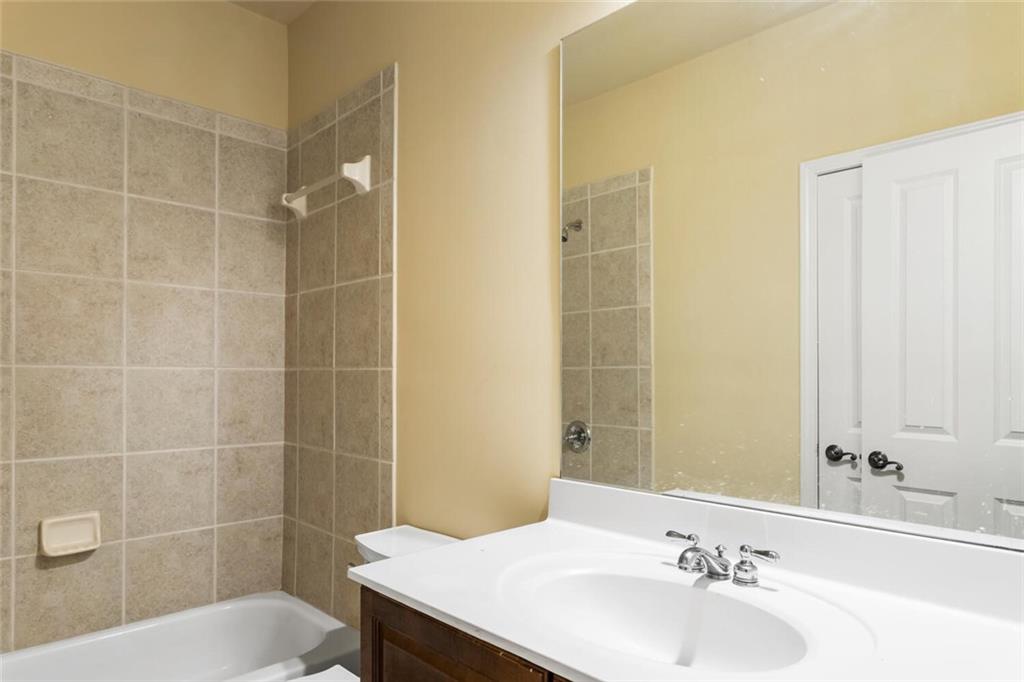 2663 Rivers Edge Drive Northeast Brookhaven, GA 30324 - Photo 33 of 37 a bathroom with a sink toilet and shower