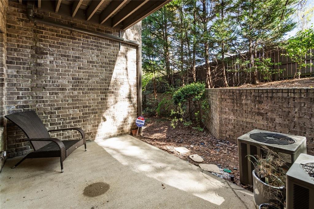 2663 Rivers Edge Drive Northeast Brookhaven, GA 30324 - Photo 34 of 37 a view of a chairs and table in the back yard
