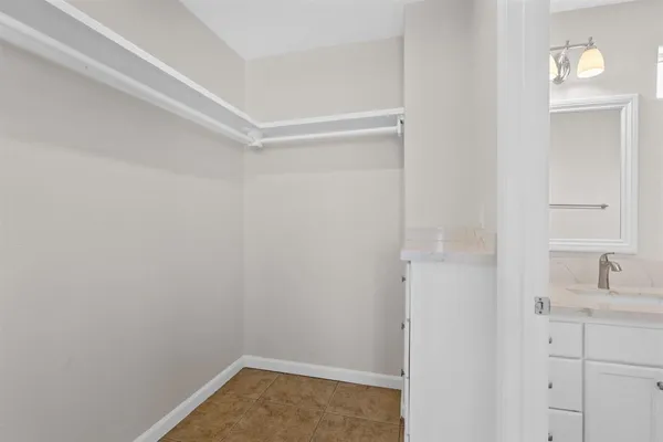 a bathroom with a sink and vanity