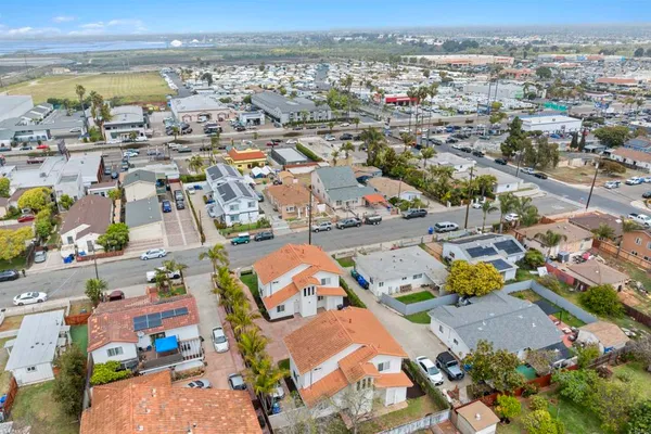 an aerial view of residential houses with outdoor space