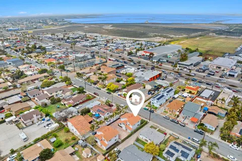 an aerial view of residential building and lake