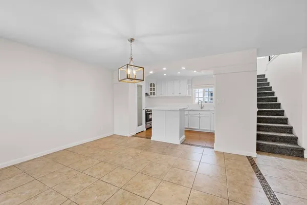 a view of a kitchen with a sink and dishwasher cabinets