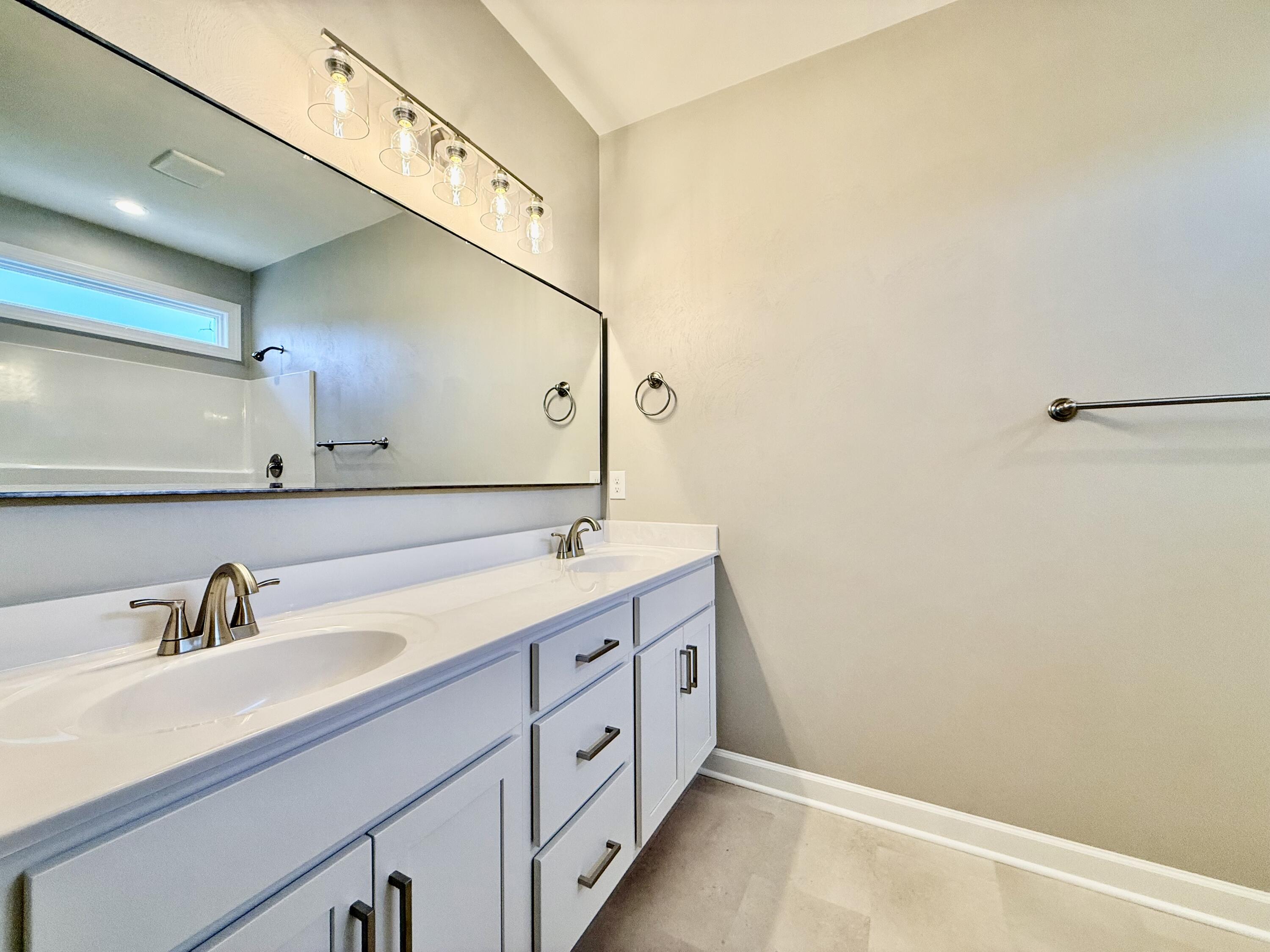 5185 Cove Road Roanoke, VA 24019 - Photo 13 of 18 a bathroom with a double vanity sink and mirror