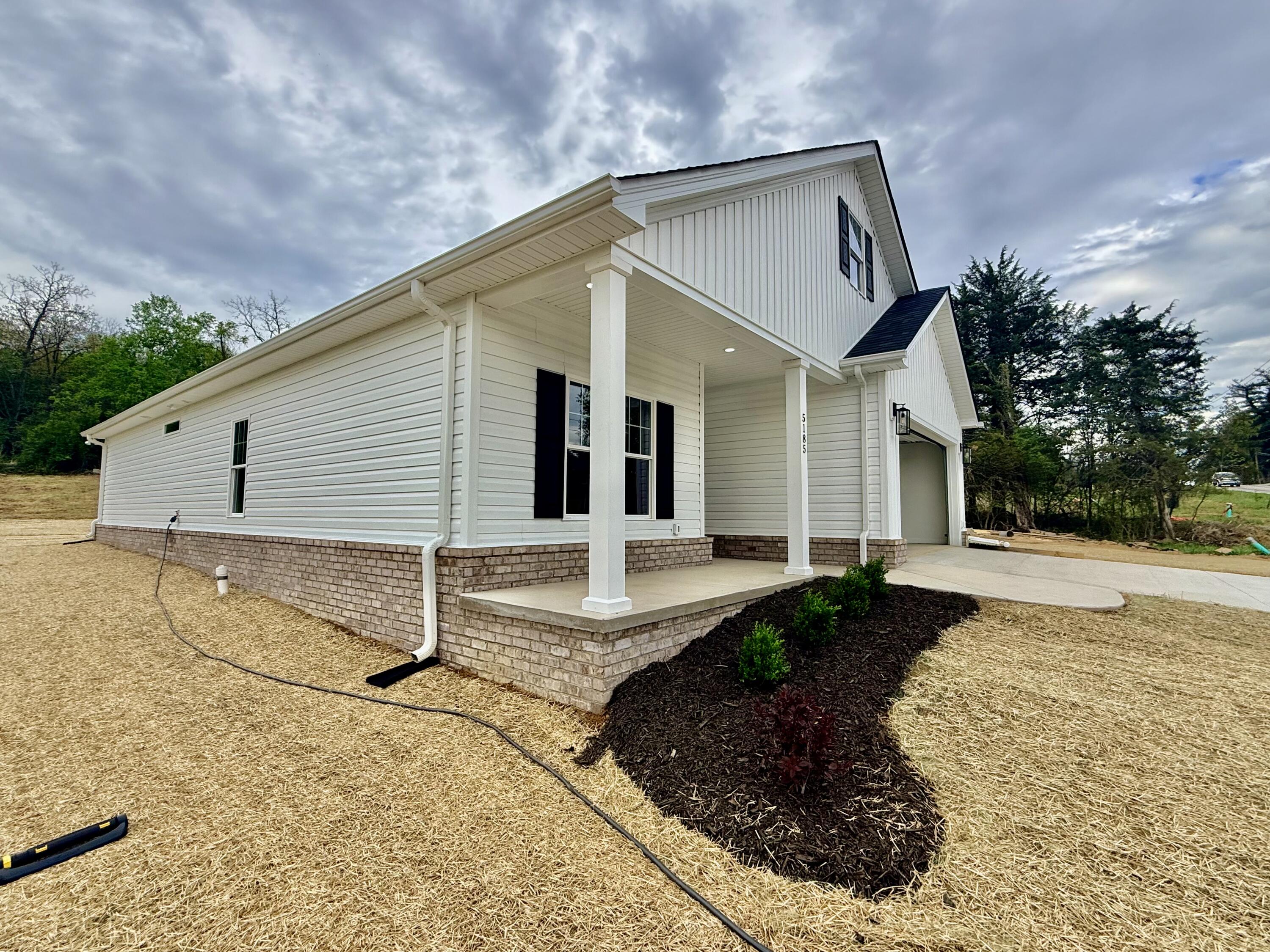 5185 Cove Road Roanoke, VA 24019 - Photo 18 of 18 a front view of a house with a yard and garage