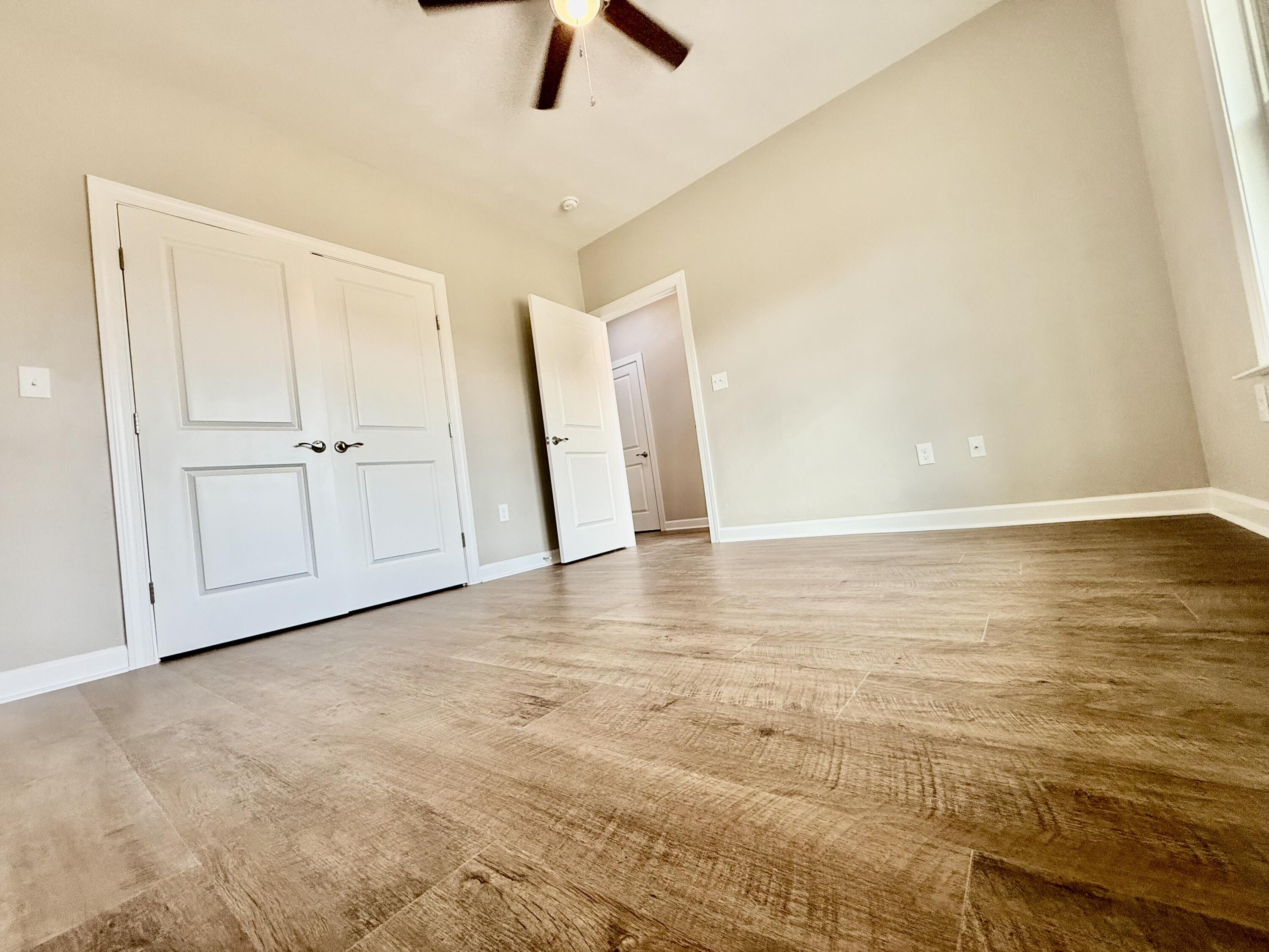 5185 Cove Road Roanoke, VA 24019 - Photo 4 of 18 an empty room with ceiling fan and entryway
