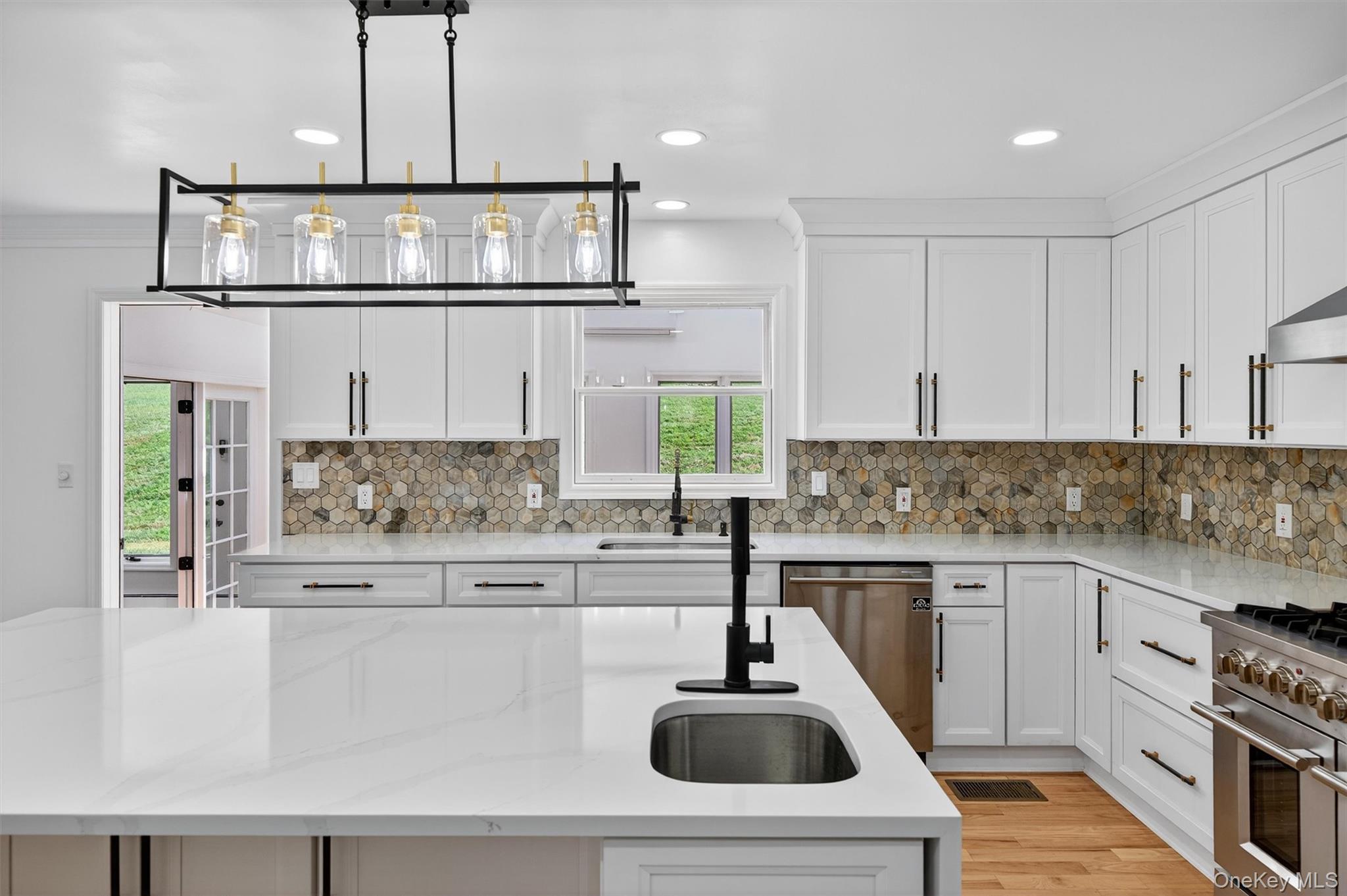 11 Deer Meadow Road Warwick, NY 10990 - Photo 12 of 42 a kitchen with stainless steel appliances a sink a stove and cabinets