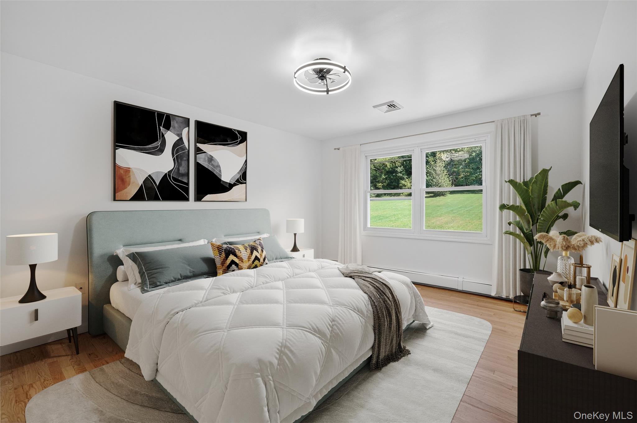 11 Deer Meadow Road Warwick, NY 10990 - Photo 20 of 42 a bedroom with a large bed and a potted plant