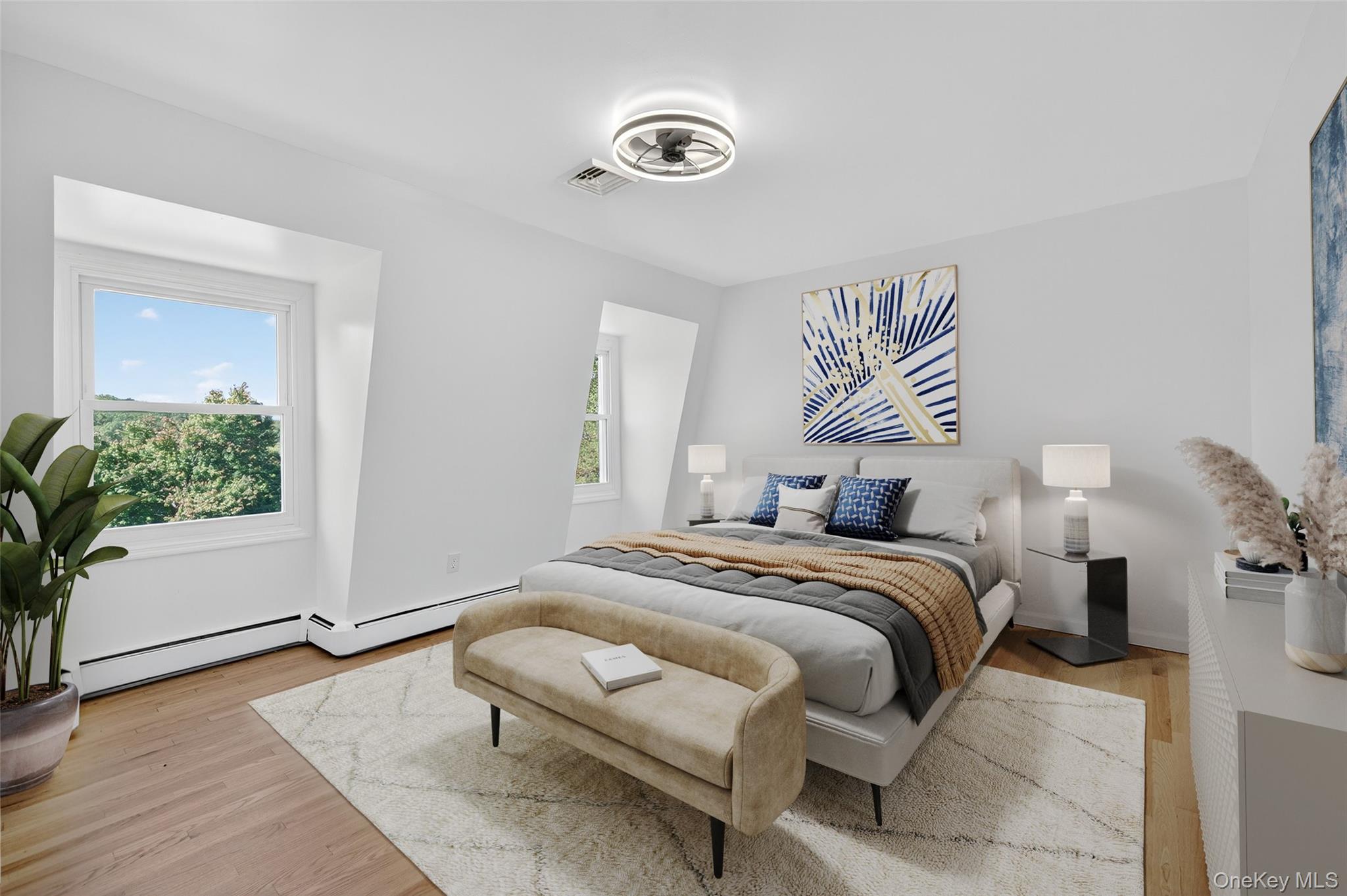 11 Deer Meadow Road Warwick, NY 10990 - Photo 21 of 42 a bedroom with a bed and a potted plant