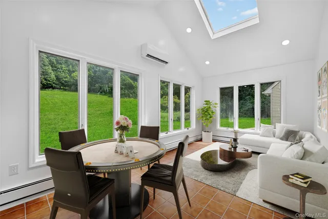 a view of a dining room with furniture window and outside view