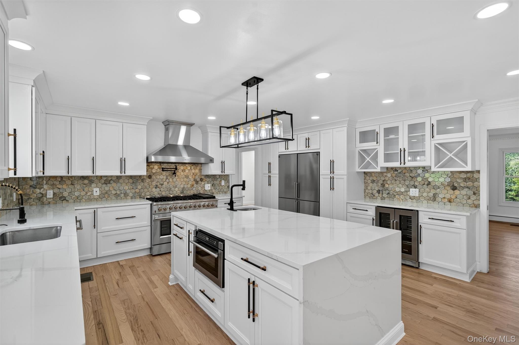 11 Deer Meadow Road Warwick, NY 10990 - Photo 3 of 42 a kitchen with white cabinets and stainless steel appliances