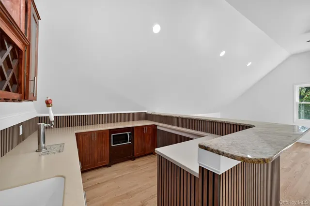 a kitchen that has a sink and a stove in it