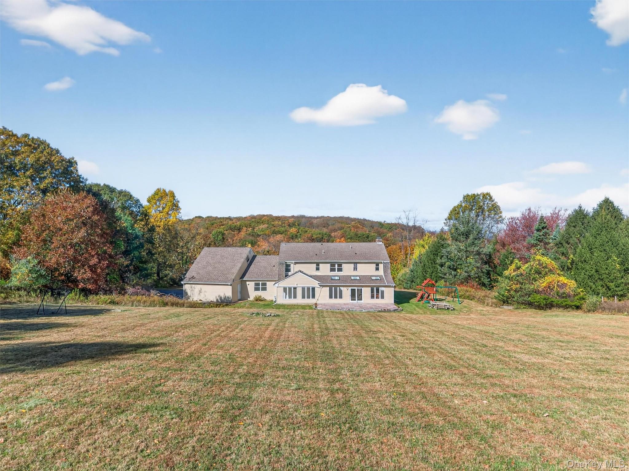 11 Deer Meadow Road Warwick, NY 10990 - Photo 39 of 42 a view of a house with a yard and car parked