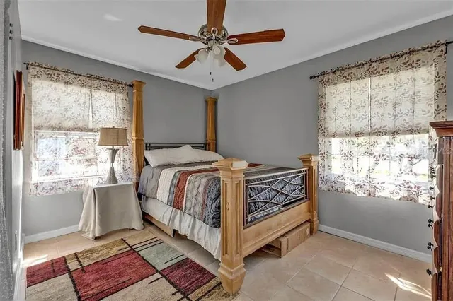 a bed room with a bed and a window