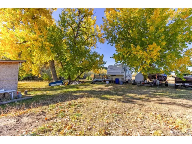 a view of a large body of water with a building in the background