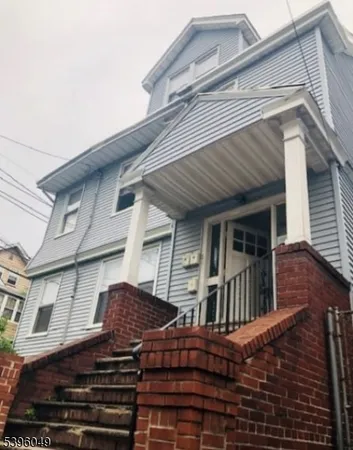 a view of a house with large windows