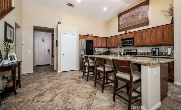 a group of chairs sitting in kitchen and dining room