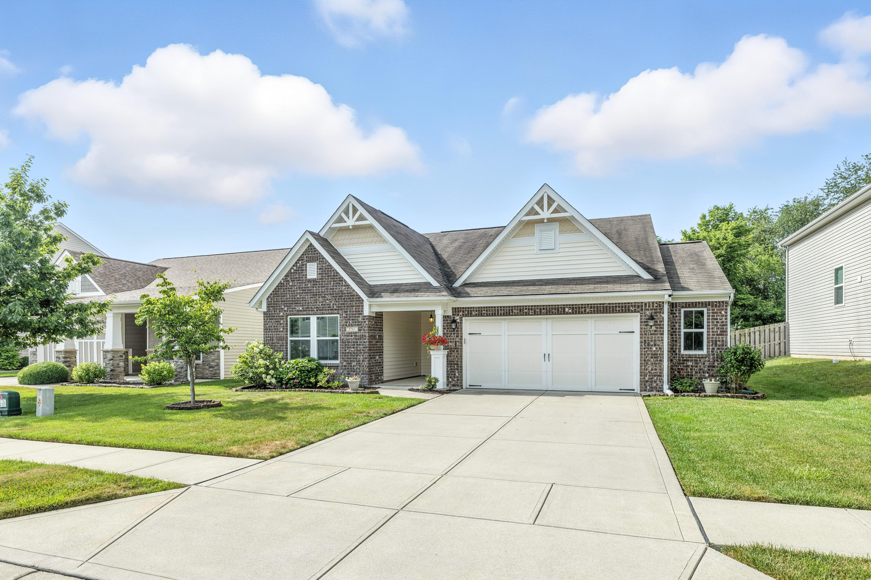 5783 Pebblebrooke Road Whitestown, IN 46075 - Photo 2 of 34 a front view of house with yard and green space