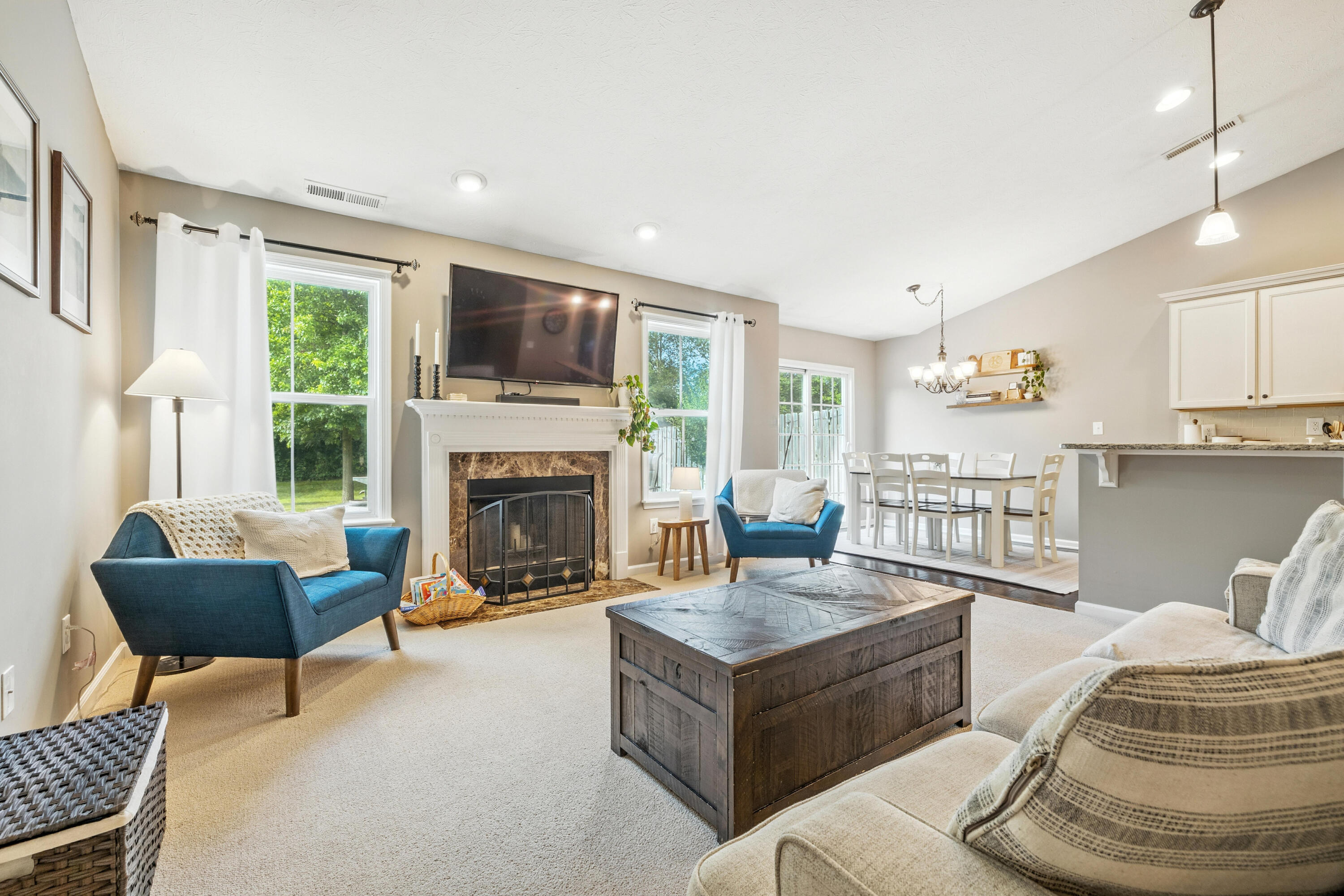 5783 Pebblebrooke Road Whitestown, IN 46075 - Photo 9 of 34 a living room with furniture and a fireplace