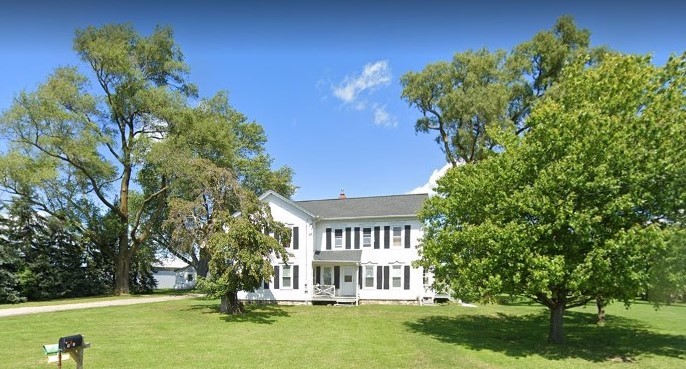a view of house with a garden