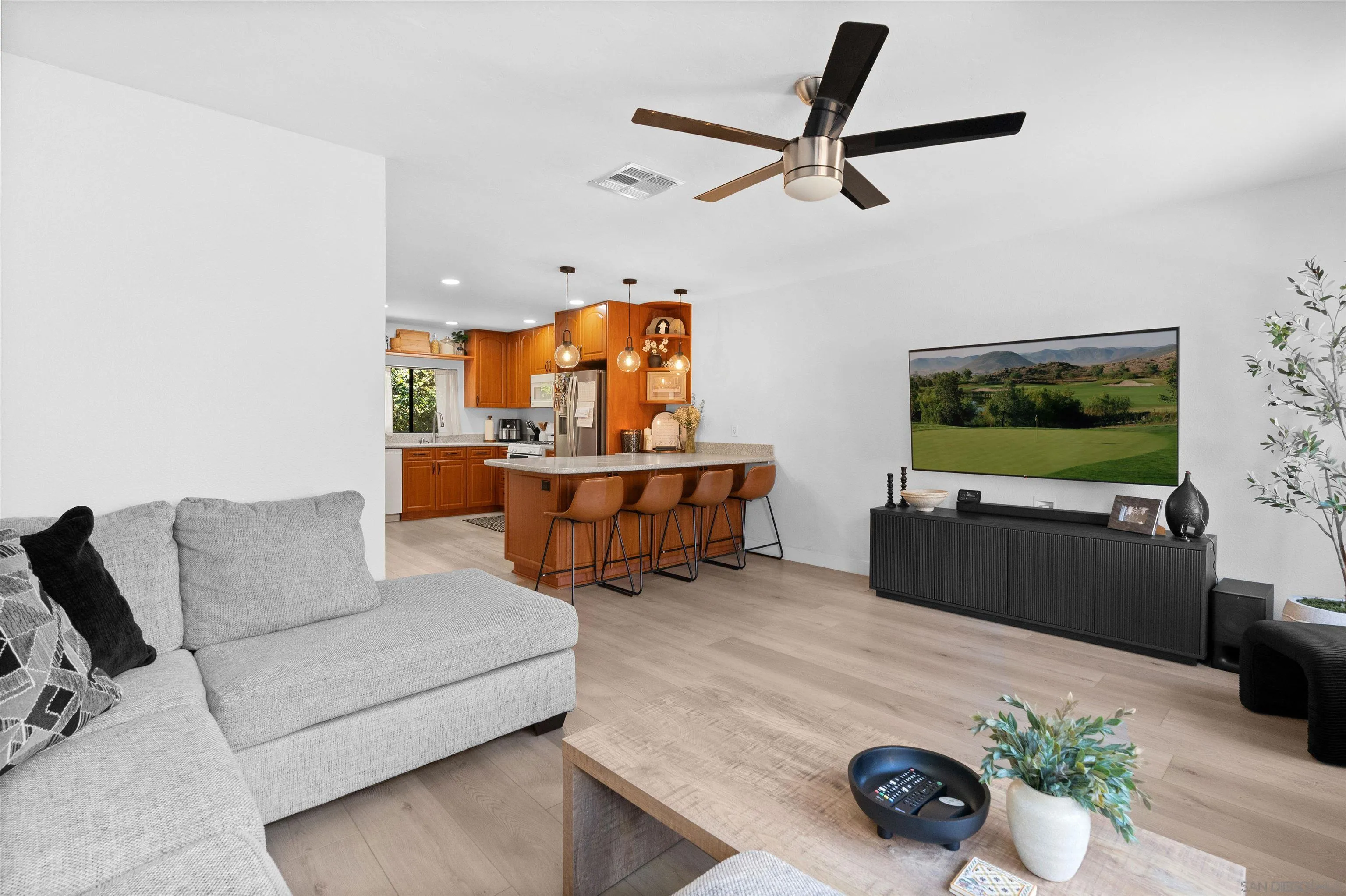 10781 Riderwood Terrace, Unit B Santee, CA 92071 - Photo 13 of 31 a living room with furniture and a flat screen tv