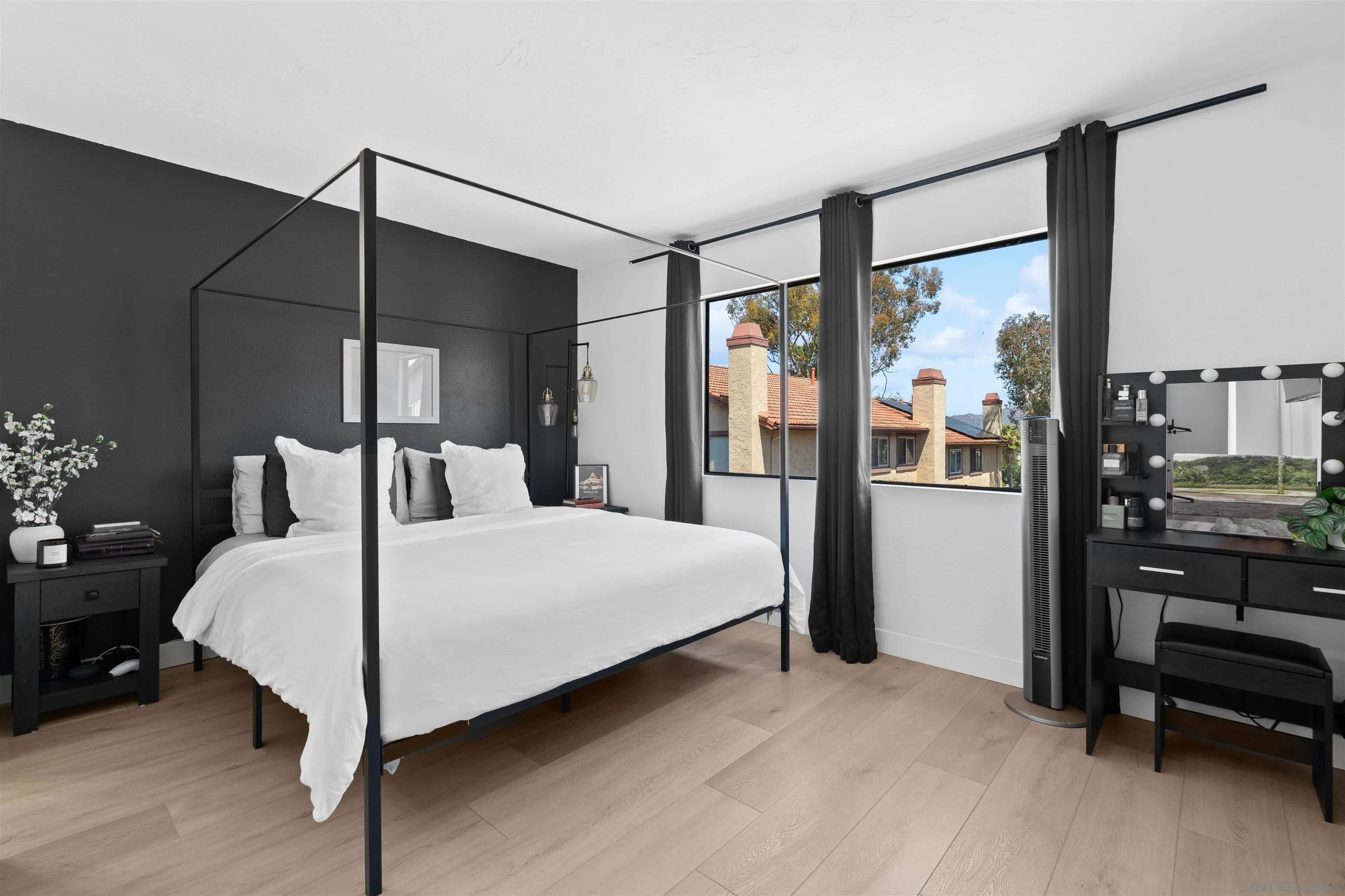 10781 Riderwood Terrace, Unit B Santee, CA 92071 - Photo 19 of 31 a bedroom with a large bed and a balcony view