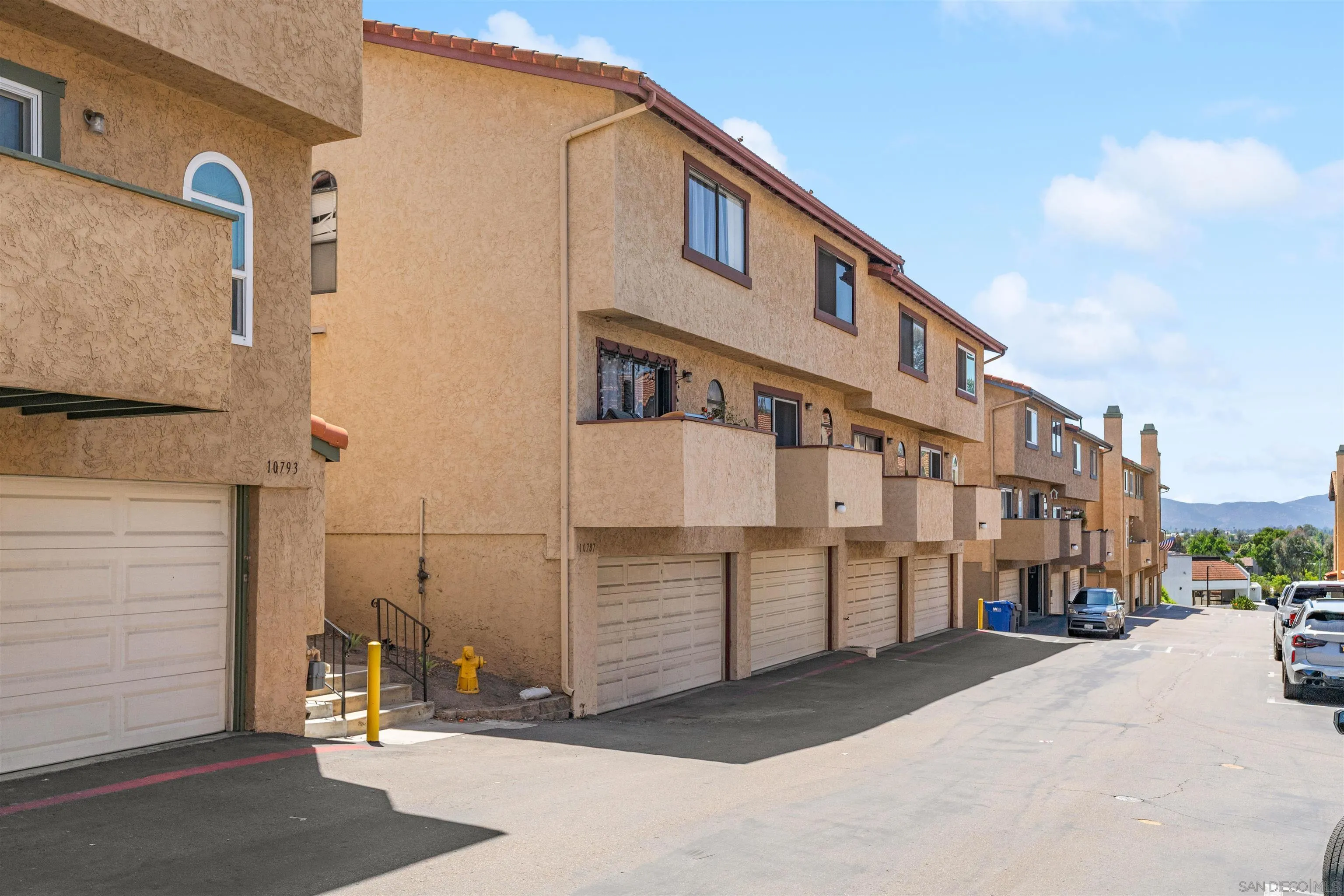 10781 Riderwood Terrace, Unit B Santee, CA 92071 - Photo 4 of 31 a view of a street with buildings