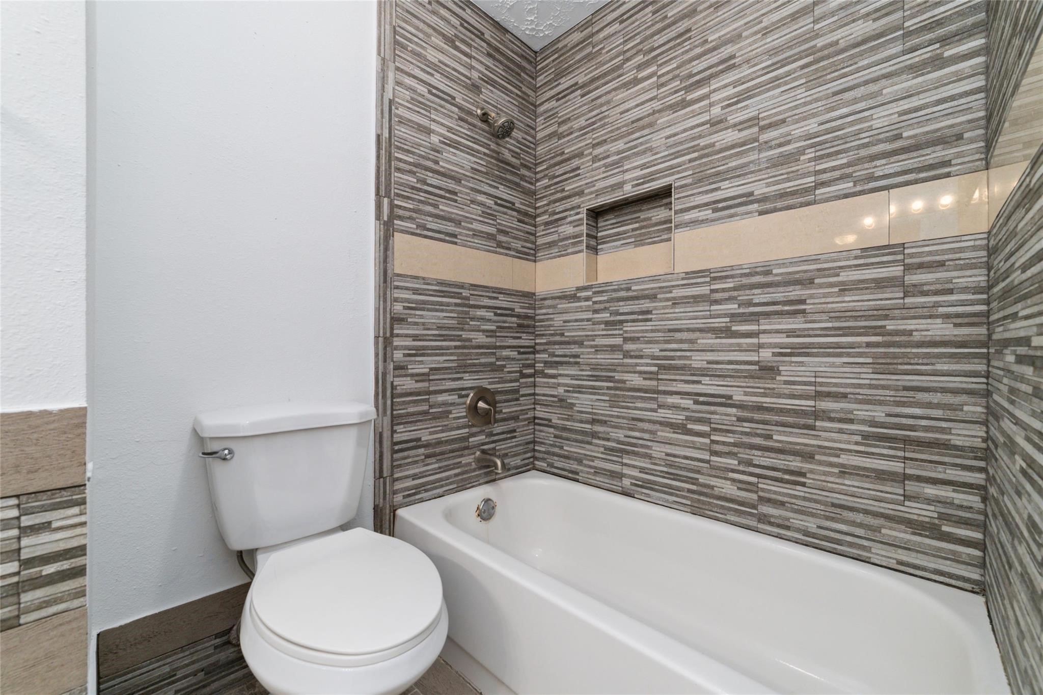 16123 Ridgegreen Drive Houston, TX 77082 - Photo 19 of 21 a bathroom with a toilet and a shower