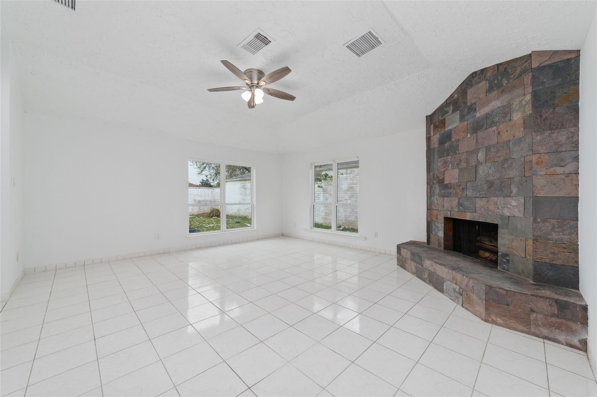 16123 Ridgegreen Drive Houston, TX 77082 - Photo 4 of 21 a living room with furniture and a fireplace