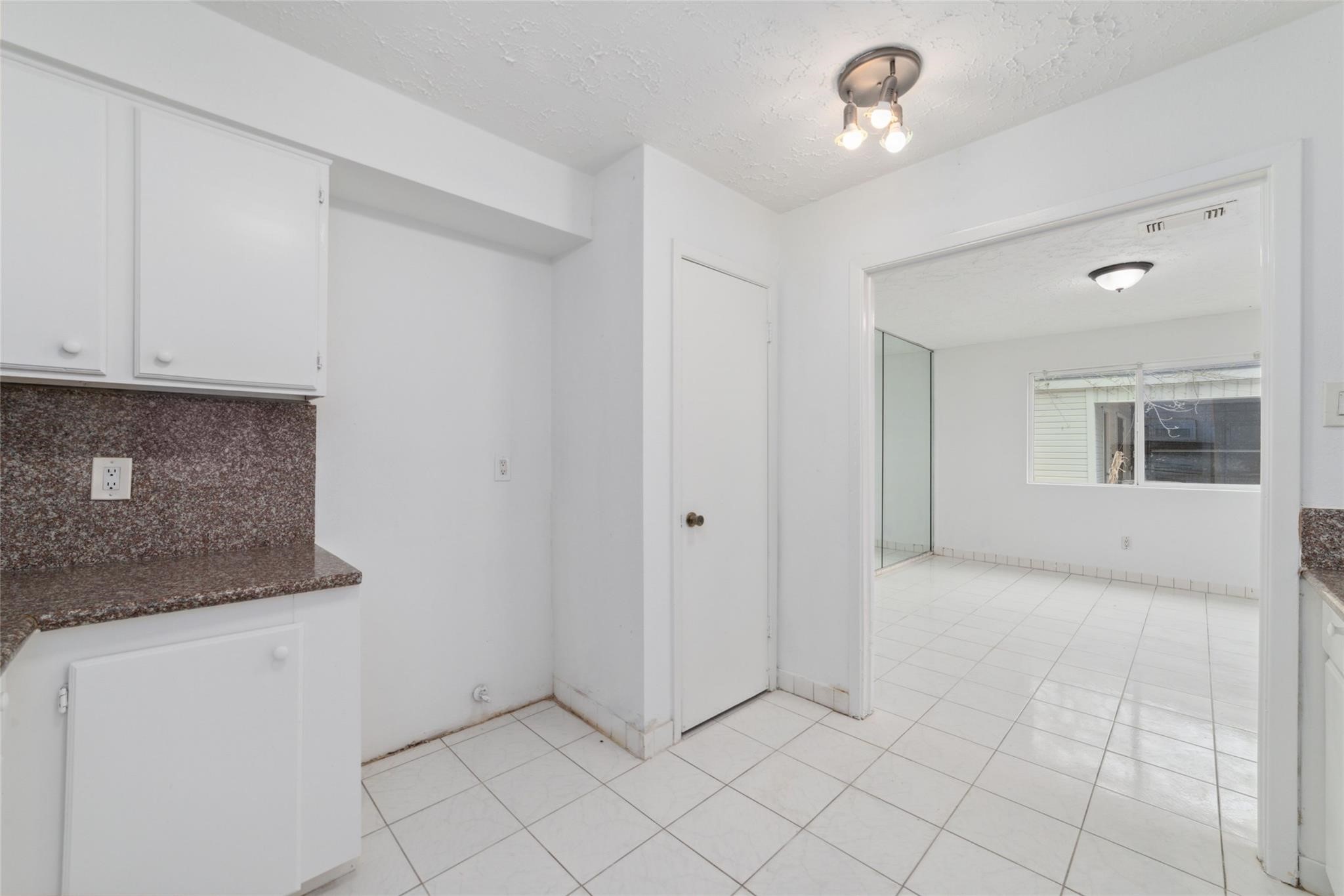 16123 Ridgegreen Drive Houston, TX 77082 - Photo 6 of 21 a view of an empty room with kitchen and a sink