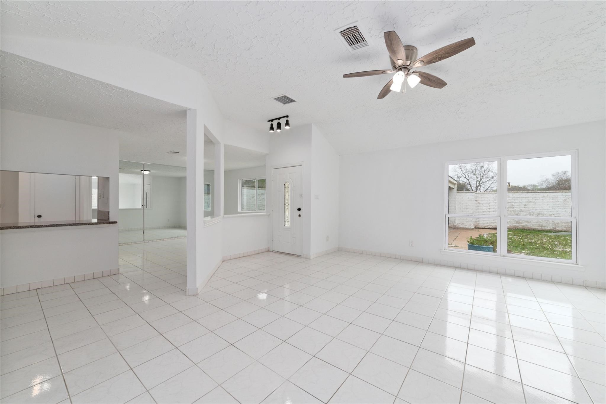 16123 Ridgegreen Drive Houston, TX 77082 - Photo 7 of 21 a view of an empty room with a window