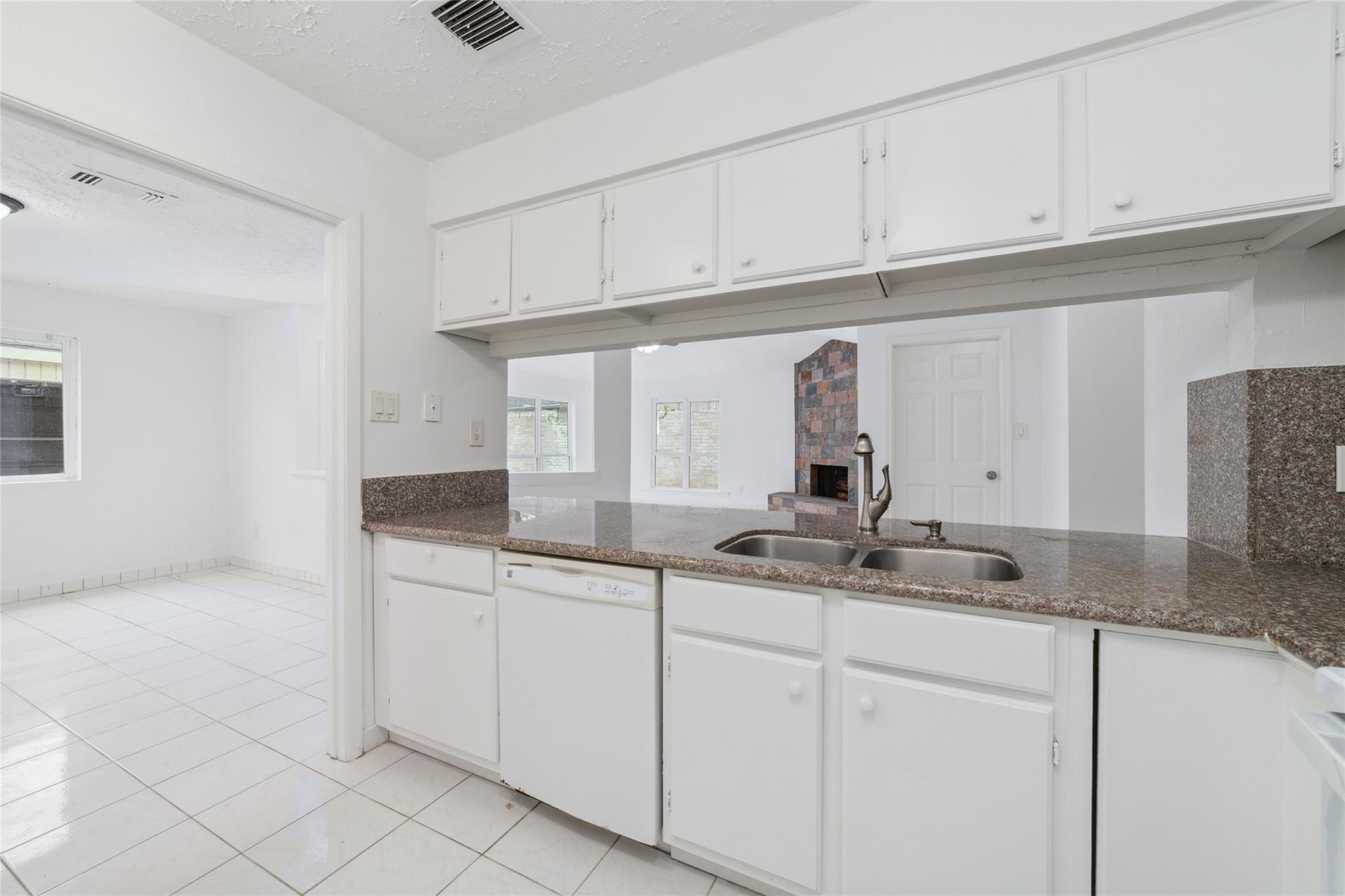 16123 Ridgegreen Drive Houston, TX 77082 - Photo 10 of 21 a kitchen with stainless steel appliances granite countertop a sink and cabinets