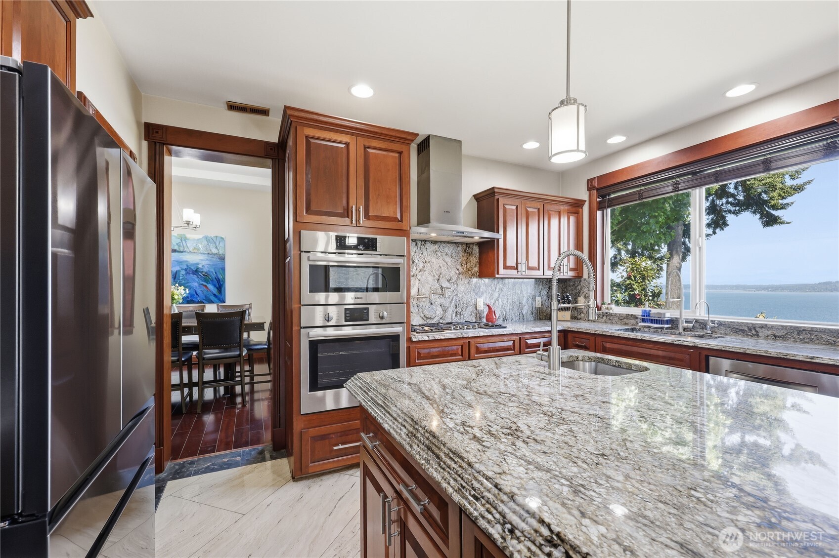 1411 Thorndyke Road Port Ludlow, WA 98365 - Photo 15 of 40 a kitchen with stainless steel appliances granite countertop a refrigerator and a sink