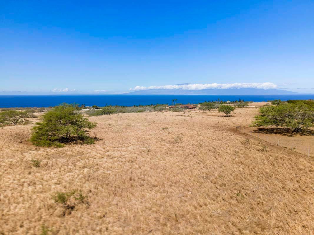 Ocean and island of Maui views. Photo taken closer to the front/ocean side of the lot.