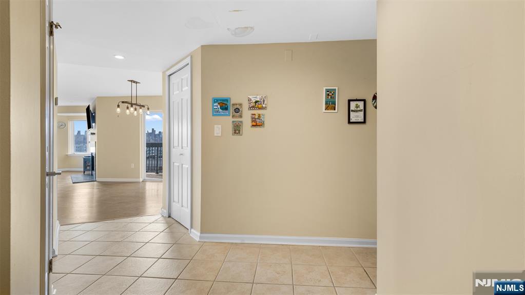605 Thornton Court, Unit T605 Edgewater, NJ 07020 - Photo 12 of 34 a view of kitchen with refrigerator and cabinets