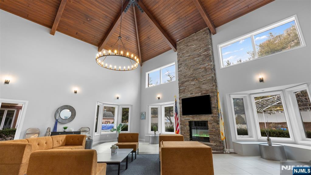 605 Thornton Court, Unit T605 Edgewater, NJ 07020 - Photo 27 of 34 a living room with fireplace furniture and a flat screen tv
