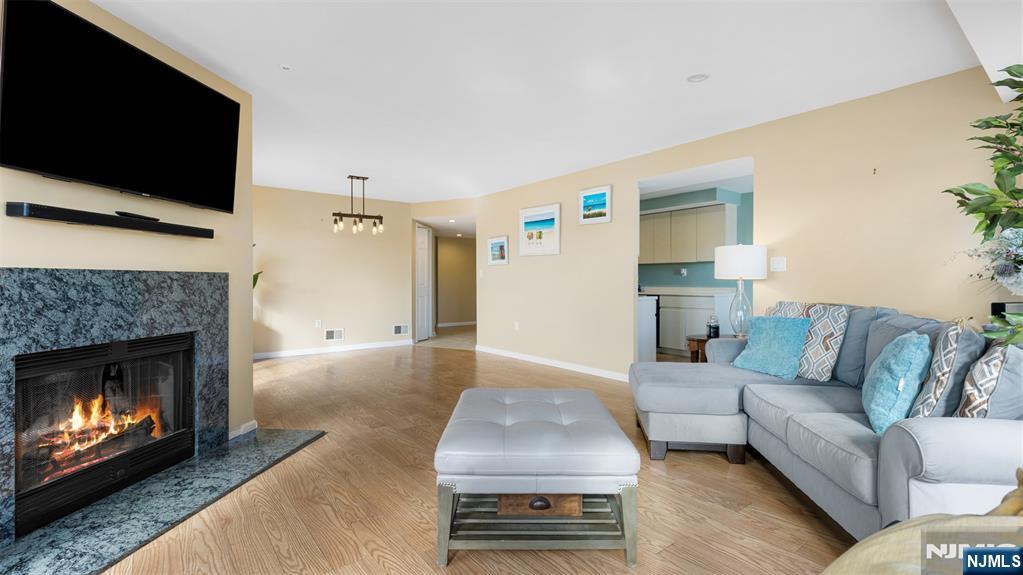 605 Thornton Court, Unit T605 Edgewater, NJ 07020 - Photo 4 of 34 a living room with furniture and a fireplace