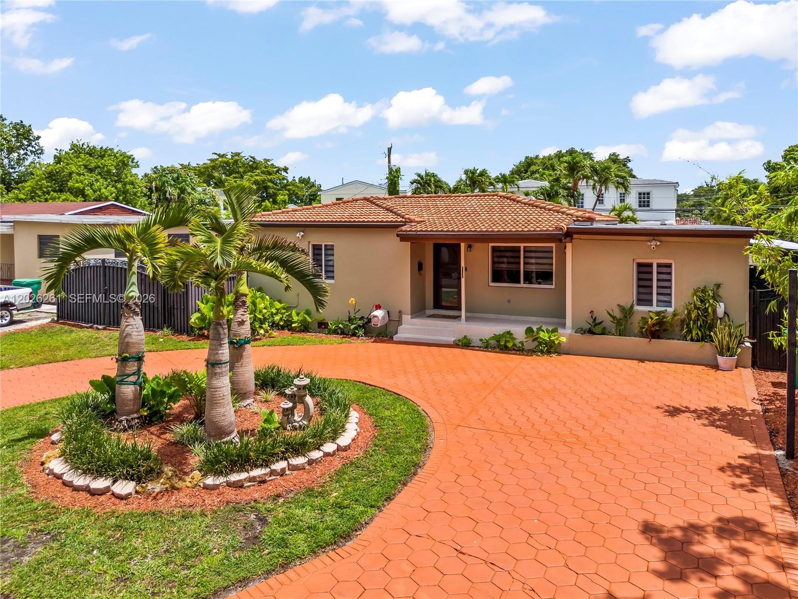 6250 Southwest 20th Terrace Miami, FL 33155 - Photo 3 of 42 a front view of a house with garden