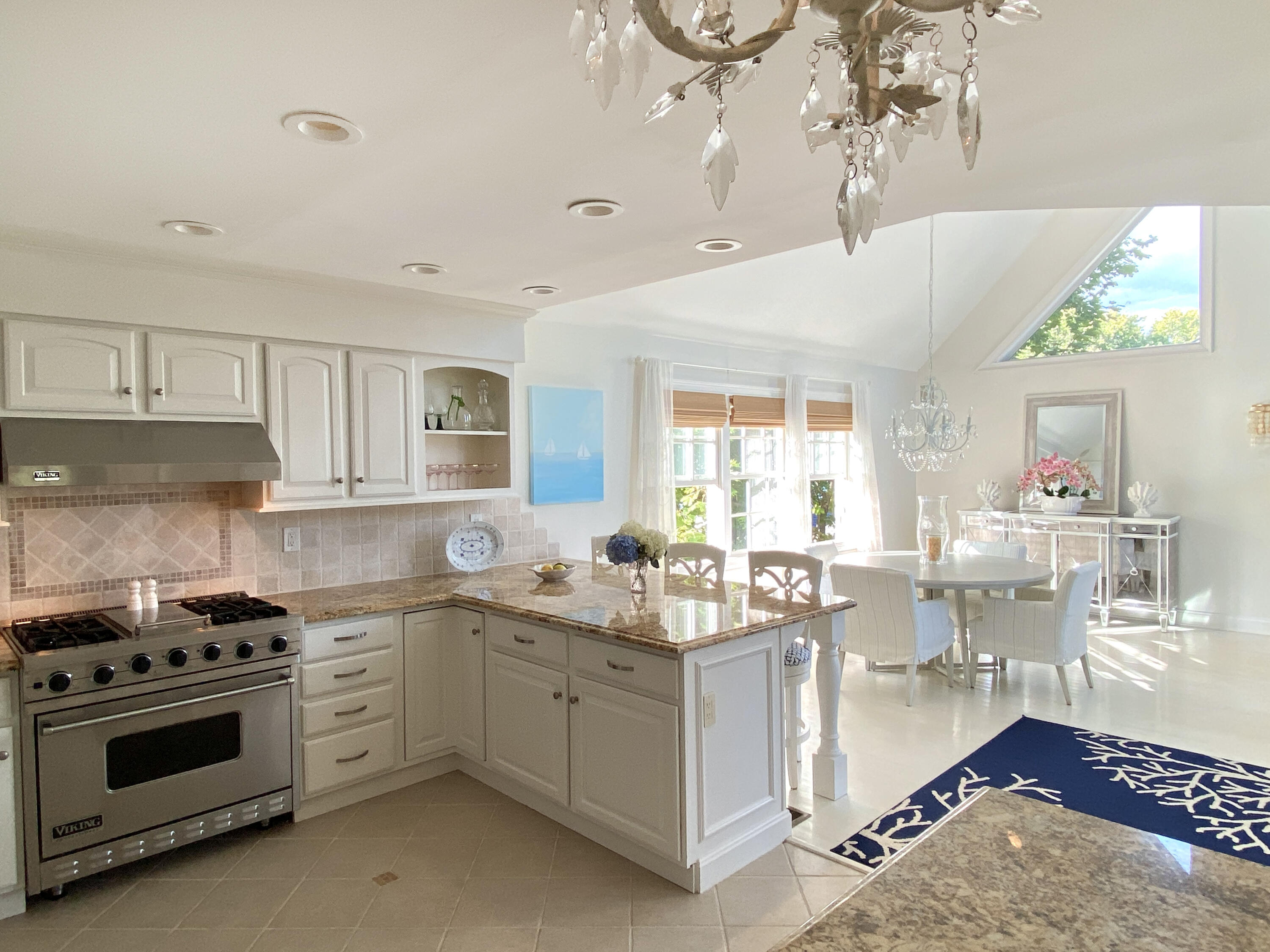 58 Roton Avenue Rowayton, CT 06853 - Photo 12 of 35 a kitchen that has a lot of white cabinets and stainless steel appliances