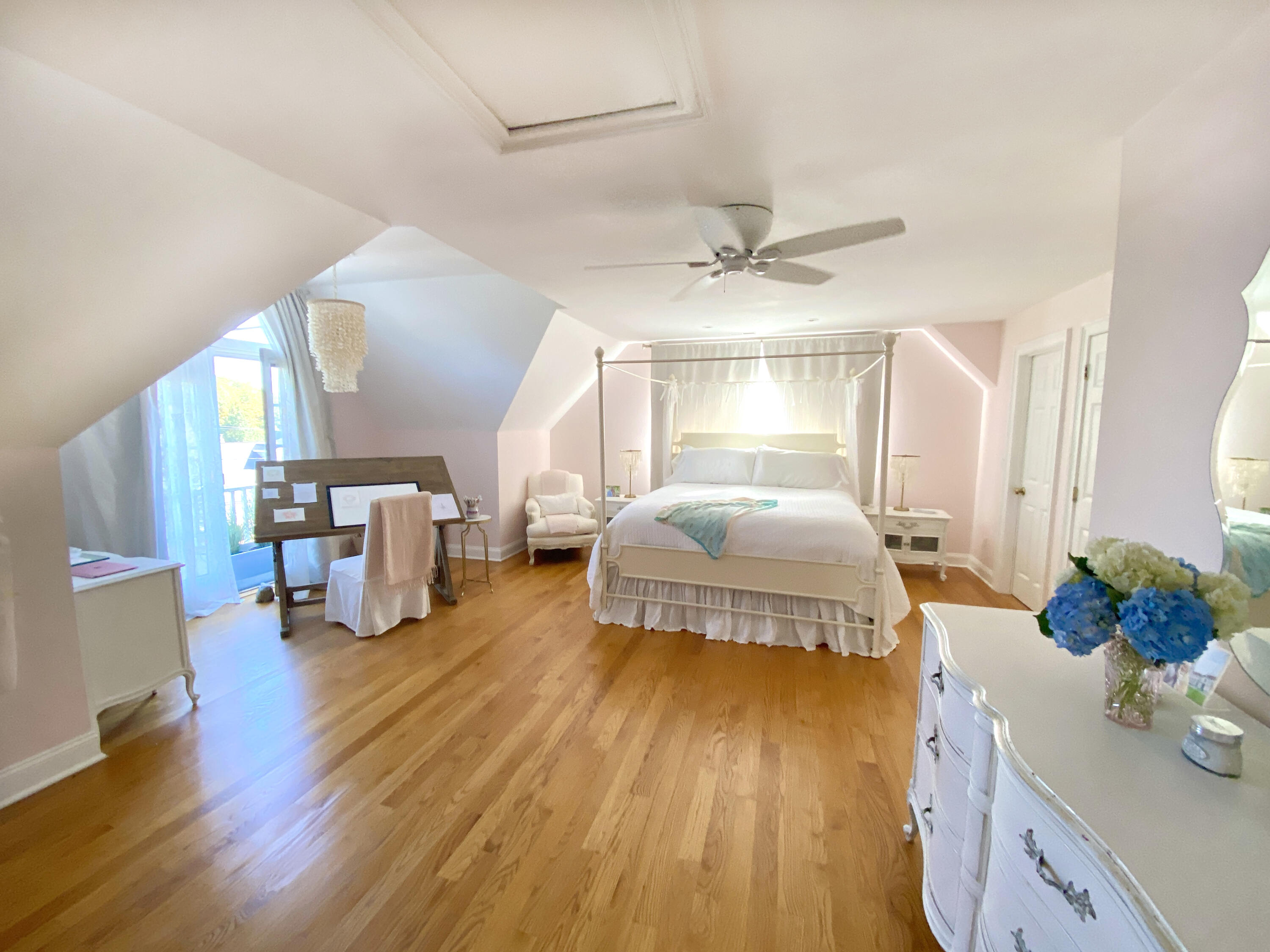 58 Roton Avenue Rowayton, CT 06853 - Photo 18 of 35 a spacious bedroom with a bed and wooden floor
