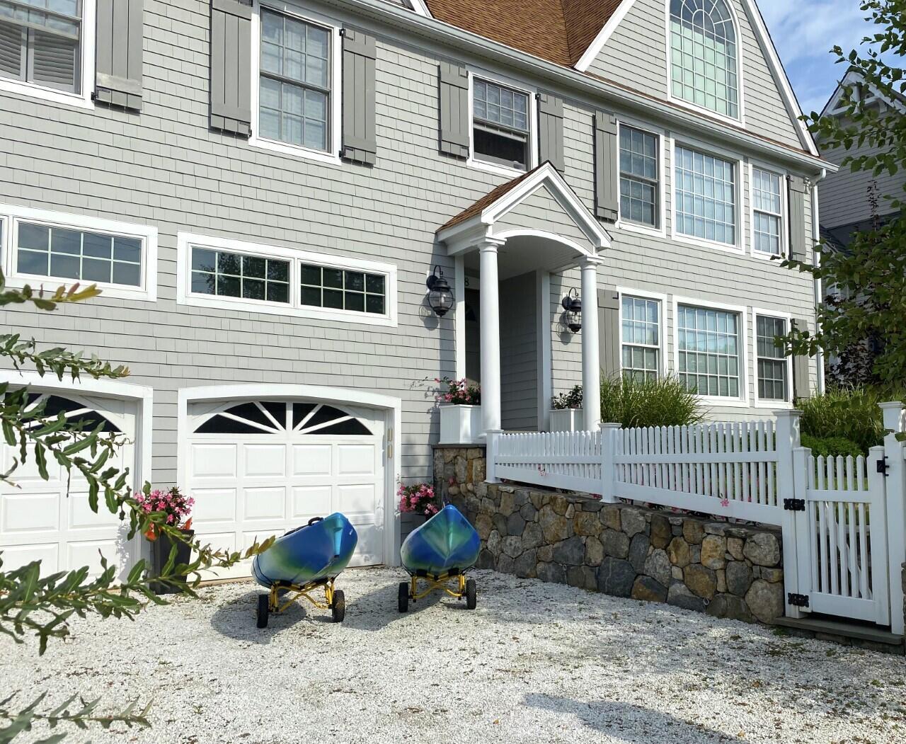 58 Roton Avenue Rowayton, CT 06853 - Photo 2 of 35 a front view of a house with patio