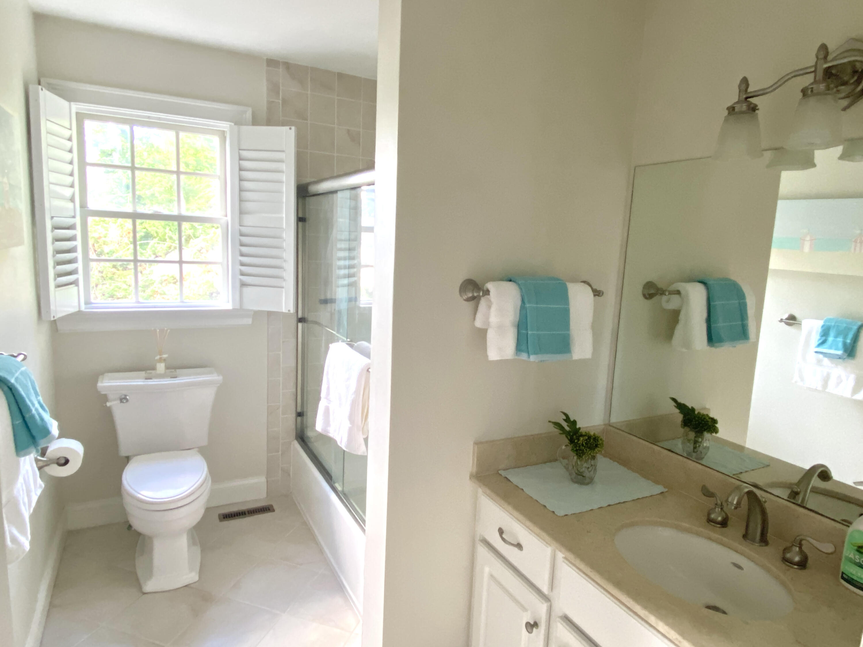 58 Roton Avenue Rowayton, CT 06853 - Photo 27 of 35 a bathroom with a granite countertop sink toilet and shower