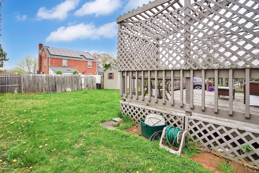 55 Chalmers Street Springfield, MA 01118 - Photo 17 of 17 a view of a chair and table in the backyard