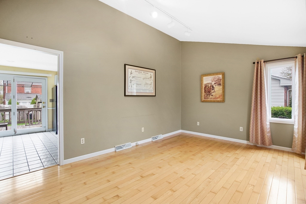 55 Chalmers Street Springfield, MA 01118 - Photo 8 of 17 a view of a room with wooden floor and windows